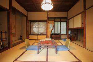 
a living room with a table and chairs at Fukuzumiro in Hakone
