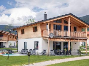 a log home with a wrap around deck at Chalet Alpenblick, Inzell in Inzell