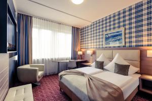 Postel nebo postele na pokoji v ubytování Mercure Hotel Kaiserhof City Center
