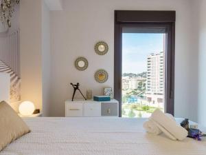 Gulta vai gultas numurā naktsmītnē Apartment, Malaga