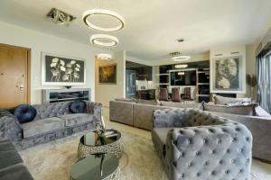a living room with couches and a fireplace at Harmony of the seas in Neoi Epivates