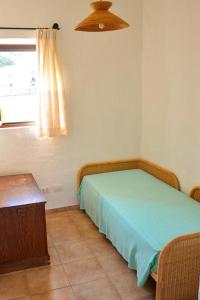 Cama ou camas em um quarto em Holiday residence I Nuraghi Cannigione - ISR01100d-CYB
