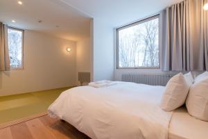 Ένα ή περισσότερα κρεβάτια σε δωμάτιο στο Chalet W by H2 Life