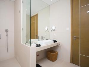 a bathroom with a sink and a mirror at Aqua Boracay in Boracay