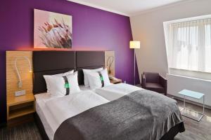 Cama o camas de una habitación en Hotel Leipzig-Günthersdorf