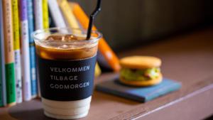 a cup of coffee and a hamburger on a shelf at BUNSHODO HOTEL in Fukuoka