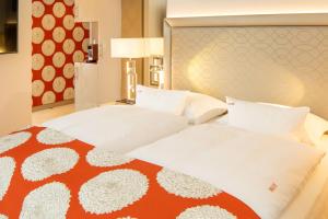 Ένα ή περισσότερα κρεβάτια σε δωμάτιο στο Boutiquehotel Das Tyrol