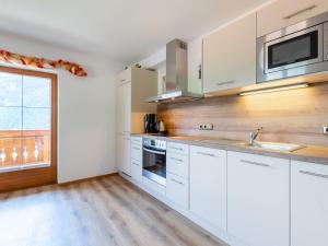 A kitchen or kitchenette at Chalet in Wald near Zillertal Ski Area