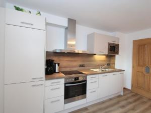 A kitchen or kitchenette at Chalet in Wald near Zillertal Ski Area