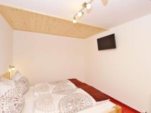 A bed or beds in a room at Chalet in Wald near Zillertal Ski Area