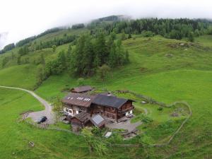 an aerial view of a house on a hill at Farmhouse with views over the valley in Rauris