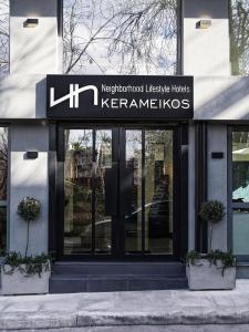 a building with a sign on the front of it at NLH KERAMEIKOS - Neighborhood Lifestyle Hotels in Athens