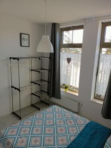 Ένα ή περισσότερα κρεβάτια σε δωμάτιο στο Apartament w porcie