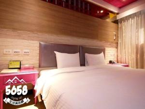 Postel nebo postele na pokoji v ubytování R8 Eco Hotel