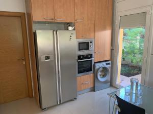 A kitchen or kitchenette at Villa Dacar