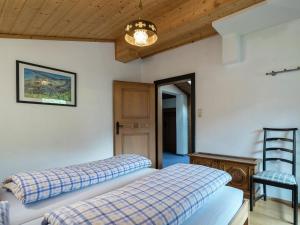 A bed or beds in a room at Apartment in Niedernsill near Zell am See Ski Lift