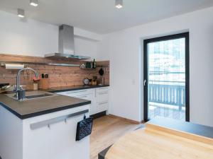 A kitchen or kitchenette at Apartment in Niedernsill near Zell am See Ski Lift