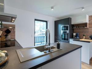 A kitchen or kitchenette at Apartment in Niedernsill near Zell am See Ski Lift