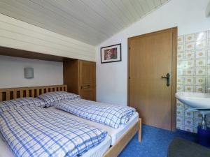 A bed or beds in a room at Apartment in Niedernsill near Zell am See Ski Lift