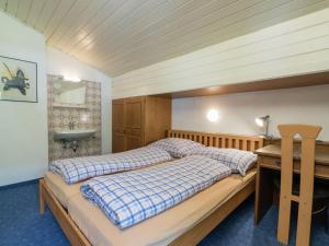 A bed or beds in a room at Apartment in Niedernsill near Zell am See Ski Lift