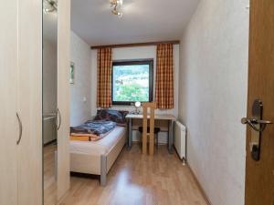 A bed or beds in a room at Apartment in Niedernsill near Zell am See Ski Lift