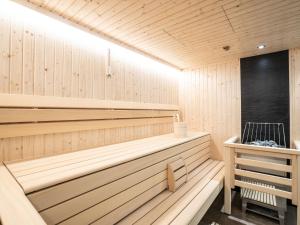a wooden sauna with a bench in a room at Chalet with garden in Bad Hofgastein Salzburg in Bad Hofgastein