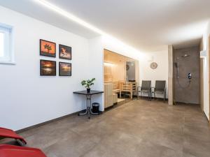 a living room with a table and a dining room at Chalet with garden in Bad Hofgastein Salzburg in Bad Hofgastein