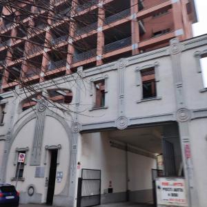 a building with a building under construction on a street at MAISON PLATONE in Alessandria
