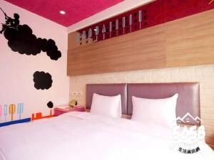 Postel nebo postele na pokoji v ubytování R8 Eco Hotel