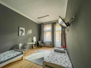 Postel nebo postele na pokoji v ubytování Moon Hostel Warszawa
