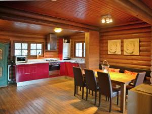 a kitchen and dining room with a table and chairs at Lovely chalet with private garden in W rgl in Hopfgarten im Brixental