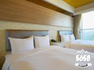 Postel nebo postele na pokoji v ubytování R8 Eco Hotel