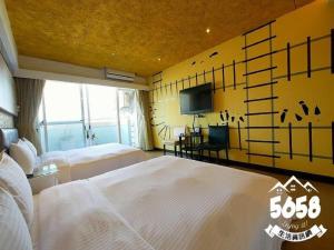 Postel nebo postele na pokoji v ubytování R8 Eco Hotel