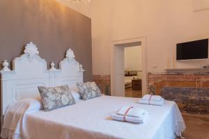 Voodi või voodid majutusasutuse MASSERIA SCALEDDA toas