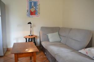 a living room with a couch and a table at Gite Gloria in Lannion