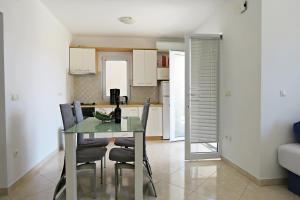 Kuchyň nebo kuchyňský kout v ubytování Andrea Apartments