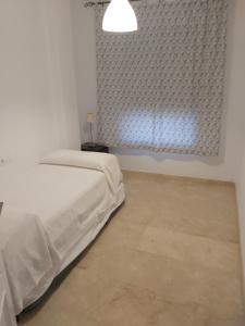 Postel nebo postele na pokoji v ubytování PLAYA VIRDECA + 1 fotografie