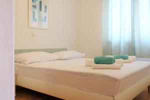 Postel nebo postele na pokoji v ubytování Andrea Apartments