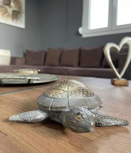a statue of a turtle sitting on a table at House of Sunset - Tranquility - View - Relaxation in Sívas