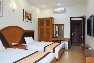 Voodi või voodid majutusasutuse Van Nam Hotel toas
