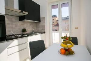 A kitchen or kitchenette at Viale Italia Boutique Rooms
