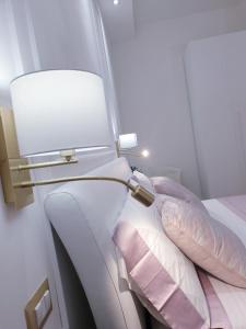 A bed or beds in a room at Viale Italia Boutique Rooms