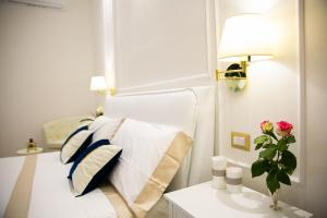 A bed or beds in a room at Viale Italia Boutique Rooms
