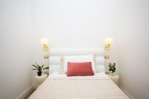 A bed or beds in a room at Viale Italia Boutique Rooms