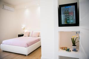 A bed or beds in a room at Viale Italia Boutique Rooms