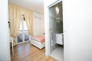 A bed or beds in a room at Viale Italia Boutique Rooms