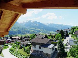 a view of a village with mountains in the background at Penthouse in ski resort in Piesendorf in Piesendorf