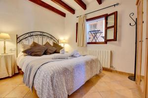 A bed or beds in a room at Villa Can Pujadas by Slow Villas
