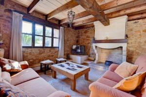 A television and/or entertainment centre at Villa Can Pujadas by Slow Villas
