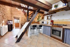 A kitchen or kitchenette at Villa Can Pujadas by Slow Villas